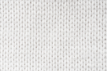 White Knit Fabric Background. Wool Sweater Texture Close Up