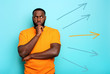 © alphaspirit - Confused Man have to choose the right arrow to follow. Concept of options, confusion, decision.