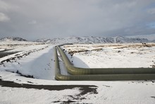 Pipelines In Iceland, Geothermal Heat Transport On Volcanic Terrain, Snow On The Barren Land