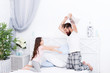 © be free - Pillow fight. Dad seeks to live life of integrity and honesty. Sincere emotions. Dad and daughter having fun. Pajamas party. Happy childhood. Upbringing happy daughter. Happy family. Role of father