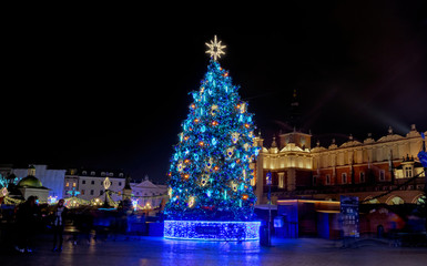 Poster - Colorful Christmas Krakow. Christmas tree in the central city square