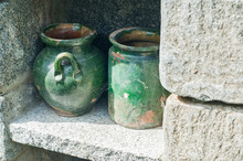 Empty Green Ceramic Clay Pots In Stone Wall Garden Niche Closeup
