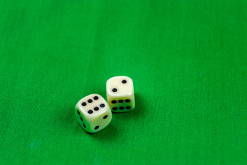 2 cubes dices on green background