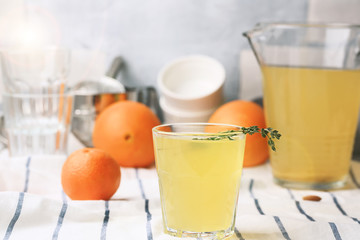 Orange drink with ginger and rosemary. Useful ingredients. Non alcoholic cocktail