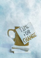 Conceptual hand writing showing Time For Change. Concept meaning Changing Moment Evolution New Beginnings Chance to Grow Coffee cup colored sticky note stacked pads plain background