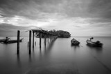 Fototapeta Pomosty - Long exposure shot of seascape in black and white.