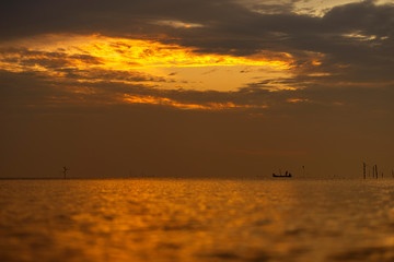 Wall Mural - Thai boat in the sea at sunrise in the morning, in a minimal style