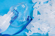 Mask for inhalation with opened empty bufuses or plastic ampoules various form and volume, selective focus. Concept image of pulmonary disease treatment.