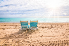 Two Empty Beach Chairs On The Beach Of Hollywood, Florida.