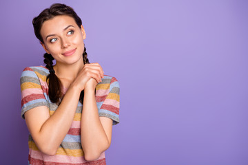 Sticker - Photo of pretty cute lady holding hands together looking empty space dreamer imagination flight wear casual striped t-shirt isolated purple color background