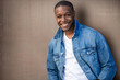 © elnariz - Close up headshot of a handsome african american man, stylish, cool, hip, casual jean jacket, with white teeth