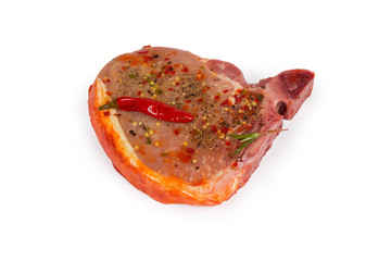 Pickled uncooked pork loin chop bone-in on white background