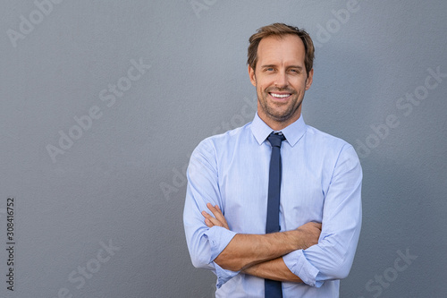 Cuadros en Lienzo Successful business man over gray wall