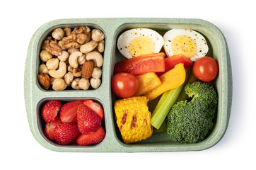 Lunch box with delicious food on a white background