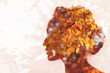 © primipil - Autumn season concept. Head silhouette of a beautiful young woman on a background of autumn leaves.