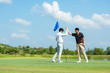 © freebird7977 - Group Professional Golfer asian man shake hand for friendship after finish put ball on green. Hobby relax in holiday and vacation with friends.  Lifestyle and Sport Concept