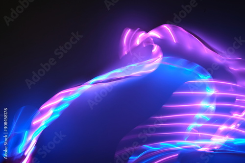 Cuadros en Lienzo Abstract background of purple and blue neon lights in motion