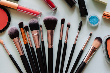 Brush and cosmetic isolated on a white background. Top view.