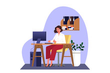 Woman In Smart Casual Sitting At The Desk And Working On The Computer