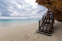Wooden Stairway On The Beach By The Ocean, Zanzibar, Africa