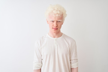 Wall Mural - Young albino blond man wearing casual t-shirt standing over isolated white background skeptic and nervous, frowning upset because of problem. Negative person.