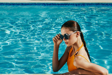 Wall Mural - young woman in swimming pool