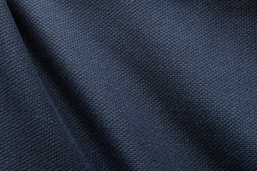 Close up shot of midnight dark blue formal suit cloth textile surface. wool fabric texture for important luxury evening or night event. Wallpaper and background with copy space for text