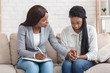 © Prostock-studio - Psychologist comforting depressed female patient during therapy session in office