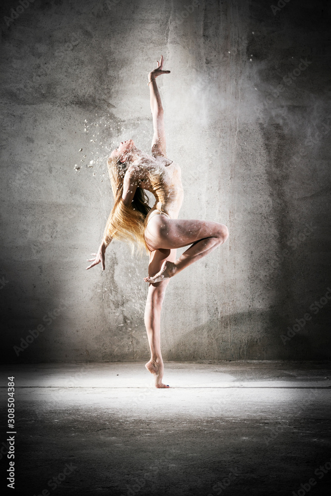 Incredibly beautiful pose of a dancer with flour. Beautiful girl ballerina with blond hair. Dance, emotion, pose, feet, ballet, modern, contemporary, theater, fitness figure, balance, body aesthetics - obrazy, fototapety, plakaty 