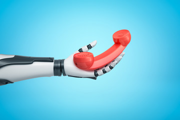 Wall Mural - robotic hand holding red retro telephone receiver on blue background