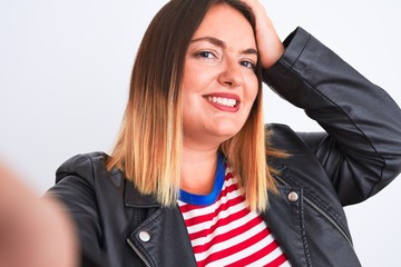 Sticker - Beautiful woman wearing striped shirt and jacket make selfie over isolated white background stressed with hand on head, shocked with shame and surprise face, angry and frustrated. Fear and upset