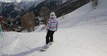 Sticker - Snowboarding in the alps, making turns, follow shot