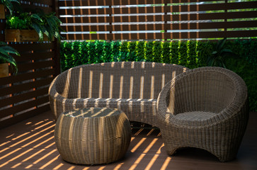 Abstract of morning light and shadow on wooden chair. Parallel lines of light and reflection provide interesting abstract interior character.