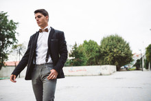 Young Man Wearing Jacket And A Wooden Bow Tie