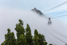 Landscape Of Sugar Loaf Mountain Cable Car Coming Out Of The Clouds