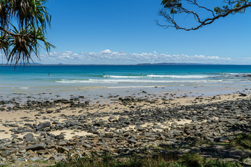 Wall Mural - the beautiful beach of Noosa on the sunshine coast in Australia with beautiful weather and blue sky with white clouds