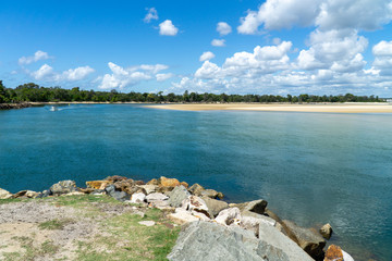 Wall Mural - the beautiful beach of Noosa on the sunshine coast in Australia with beautiful weather and blue sky with white clouds