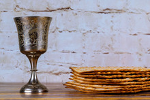 A Jewish Matzah Bread With Wine In Kiddush Cup. Passover Holiday Concept
