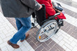 © O de R - Old woman in a wheelchair. Volunteer social worker helps for disabled people and elderly people. People care about old parents.