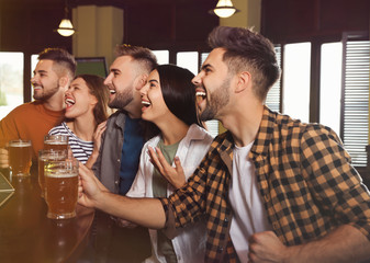 Sticker - Group of friends watching football in sport bar