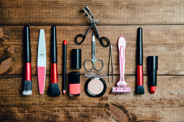 Canvas Print - A set of cosmetics on a wooden table. The concept of doing makeup, caring for the appearance of women. Applying brushes, eye shadows, powder.