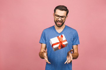 wonderful gift! adorable photo of attractive man with beautiful smile holding his birthday present b