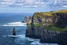 The Famous Cliffs Of Moher, Tourist Viewing Location Of Spectacular Sea Cliffs In The Burren Region Of County Clare, Ireland. O'Brien's Tower Visible.