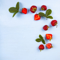 Wall Mural - Ripe strawberries and leaves