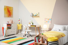 Stylish Child Room Interior With Comfortable Bed And Desk