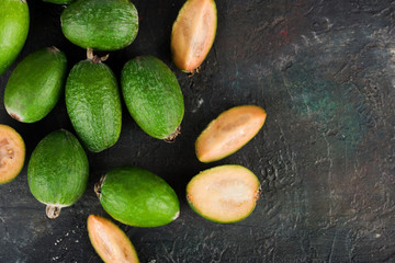 Ripe and healthy fruit feijoa. Eight feijoa on a dark background.