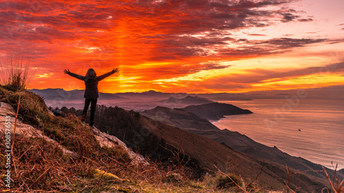 Cuadros en Lienzo A young girl at sunset on Mount Jaizkibel. Gipuzkoa