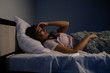 Stressed female insomnia. Young lady lying in the bed and want to sleep