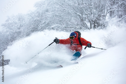 Fotografía A skier is in the deep snow.
