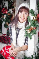 Wall Mural - girl on the veranda of the house with Christmas decor